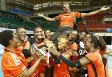 Malkia Strikers players carry their coach, Paul Bitok, in celebration after clinching their Olympics ticket.