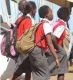 Learners walk home after schools were closed. The government is finding itaself within a hard place and a rock on making a decision whether to reopen schools soon or not.
