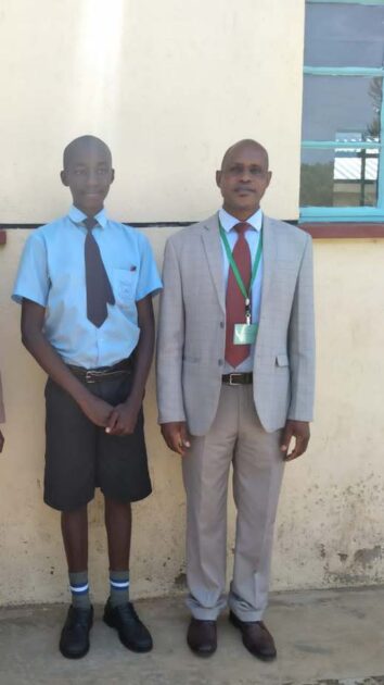 Head teacher of Eronge Adventist Boarding School in Nyamira County with Griffins Amwoma who scored 427 marks in KCPE 2020. Exam