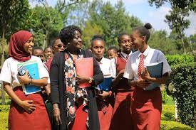 Former Sironga Girls High School Principal, Eve Odhiambo, with her students