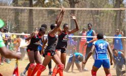 Past action in Girls Volleyball at the East Africa School Games, FEASSSA. Kwanthanze players (in black)celebrate after scoring a point against Rwanda's IPRC Kigali during the East Africa Games volleyball semis in Arusha Tanzania