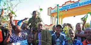 Nyambaria High School's students and staff celebrate after posting a stelllar performance at a past KCSE Exam