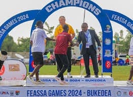 International Schools' Sports Federation (ISF) President Mr. Petrynka (in yellow top) attends the 21st edition of the FEASSSA games in Mbale City of Uganda. He was flanked by Justus Mugisha (in suite) and who is the President of USSSA and FEASSA.