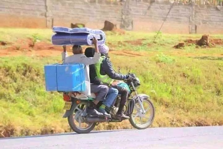 Schools, Businesses feel effect of lack of form one admissions in 2025 1 A parent boards a motor bike as he escorts his son to Secondary school for admission in this file photo.