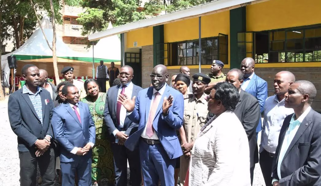 Embu County records smooth transition of grade 8 learners to Junior Secondary 2 Basic Education Principal Secretary, Dr. Belio Kipsang (with raised hands), speaks at Murema Primary and Junior School in Kasarani when he toured the school to assess the reporting of students for the first term. The PS also inspected new classrooms constructed by the Ministry of Education.