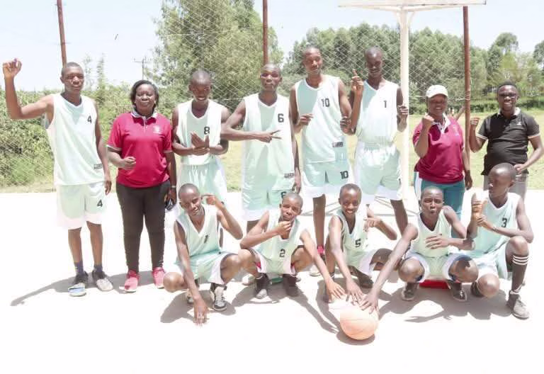 Enkare Ngiro Secondary players pose for a photo after winning the final match against Ololulung’a Boys High School at Ololulung’a playground on February 22,2025. PHOTO/COURTESY