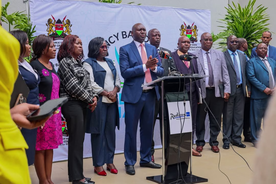 Education News: KEMIS Set to Replace NEMIS, But Critics Argue It's an avenue to loot 1 PS Basic Education Prof. Julius Bitok (Centre) when he unveiled the multi-agency team tasked with consolidating existing registers for all students on May 15, 2025.